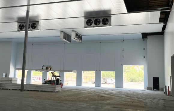 Distribution warehouse with freezer, cooler, and shipping dock